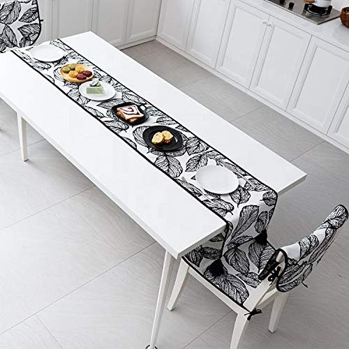 Fennco Styles Black and White Leaf Woven Table Runner - 14 x 71 Inch Reversible Runner Table Centerpiece for Dining Home Decor, Indoor Parties, Holiday Events Tassel Table Runner